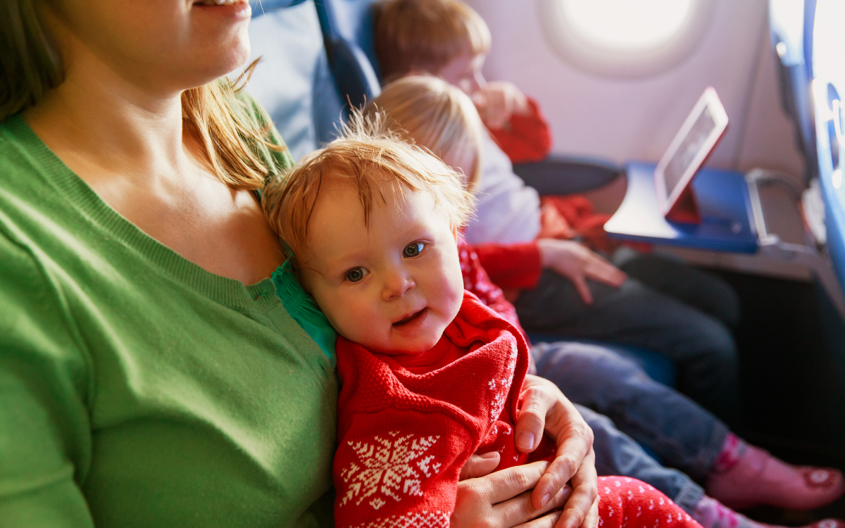 Essentials And Tips For Long Plane Trips With Big Kids - Lay Baby Lay